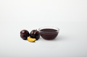Plum aseptic fruit puree in 44 lb packaging for breweries, hard seltzers, beverages, ice cream, sauces, desserts, and food manufacturing applications