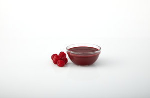 Raspberry aseptic fruit puree in 11 lb packaging for breweries, hard seltzers, beverages, ice cream, sauces, desserts, and food manufacturing applications