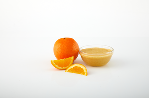 Orange aseptic fruit puree in packaging for breweries, hard seltzers, beverages, ice cream, sauces, desserts, and food manufacturing applications