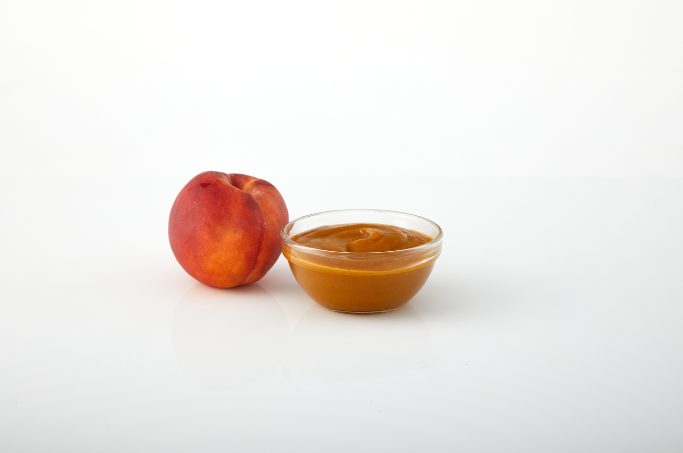 Peach aseptic fruit puree in packaging for breweries, hard seltzers, beverages, ice cream, sauces, desserts, and food manufacturing applications