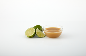 Lime aseptic fruit puree in packaging for breweries, hard seltzers, beverages, ice cream, sauces, desserts, and food manufacturing applications