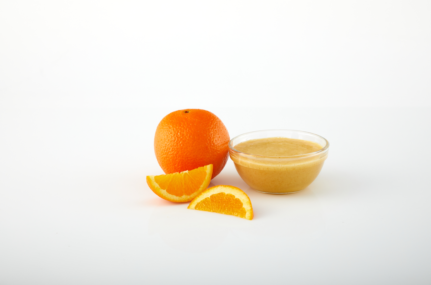 Orange aseptic fruit puree in packaging for breweries, hard seltzers, beverages, ice cream, sauces, desserts, and food manufacturing applications
